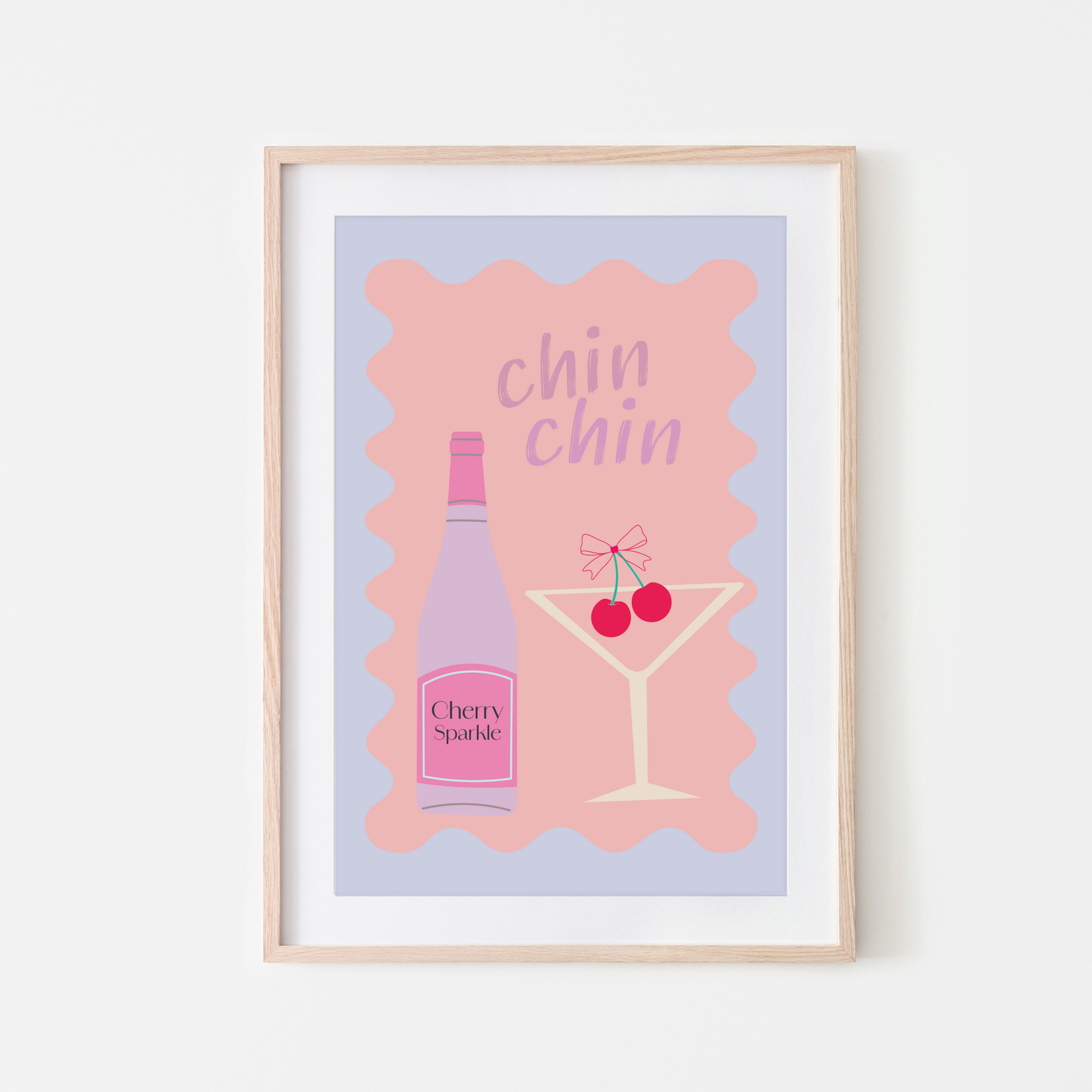 A framed wall art print with a pink background featuring a cherry cocktail and the text 'chin chin'.