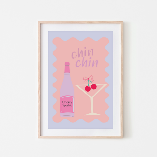 A framed wall art print with a pink background featuring a cherry cocktail and the text 'chin chin'.