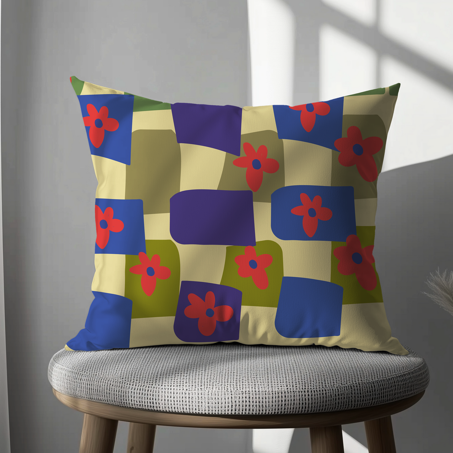 Decorative pillow with colorful geometric pattern on a chair