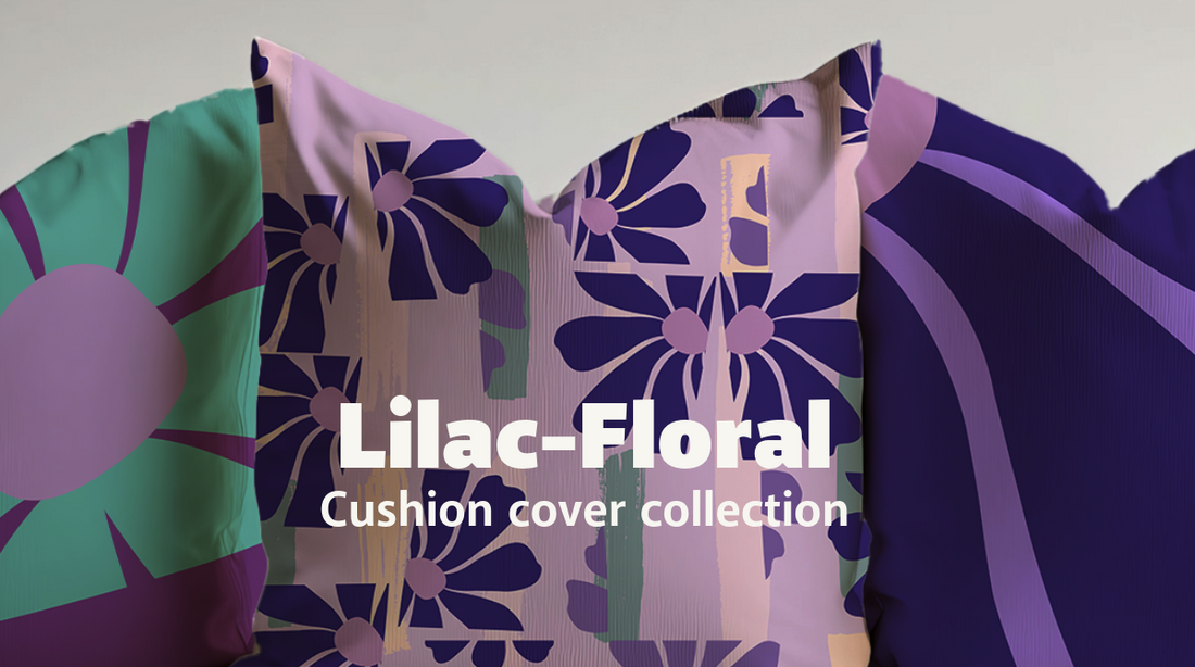 Decorative cushion cover with bold navy blue abstract floral design on a lilac background, accented with pastel green, peach, and lavender brush strokes – modern summer home décor from Pillows and Patterns.