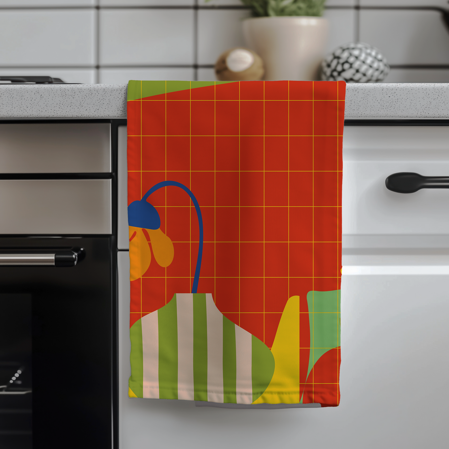 modern design kitchen tea towel with bold orange and floral design in a modern kitchen
