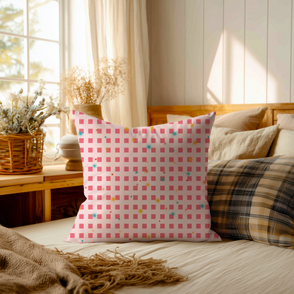 Pink checkered pillow on a bed with a cozy bedroom setting