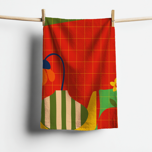 Colorful towel with abstract design hanging on a clothesline against a white background