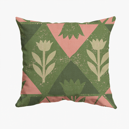 A square throw pillow featuring a geometric pattern of green and pink triangles with beige stylized tulip motifs, shown against a plain white background.