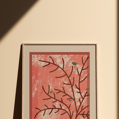 A framed botanical art print featuring dark brown branch silhouettes on a textured coral-pink background, displayed on a warm beige wall with a diagonal shadow.