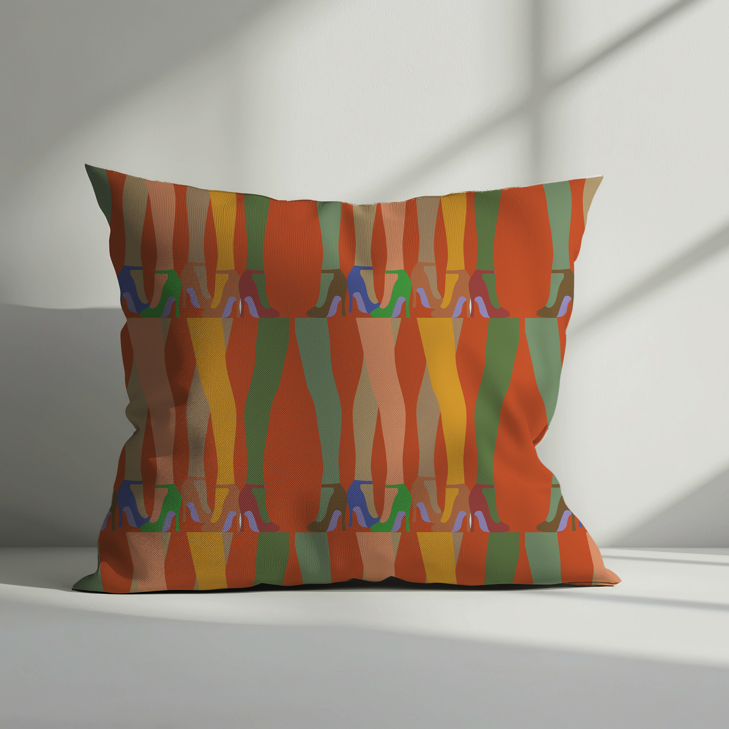 Decorative cushion cover featuring a bold leg and high heel print in vibrant colours on rich velvet fabric, styled in a modern sunlit interior.