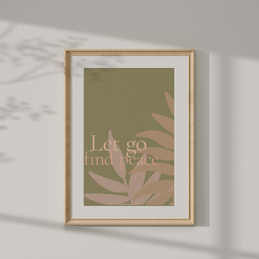 Framed artwork with 'Let go find peace' text and leaf design on a wall.