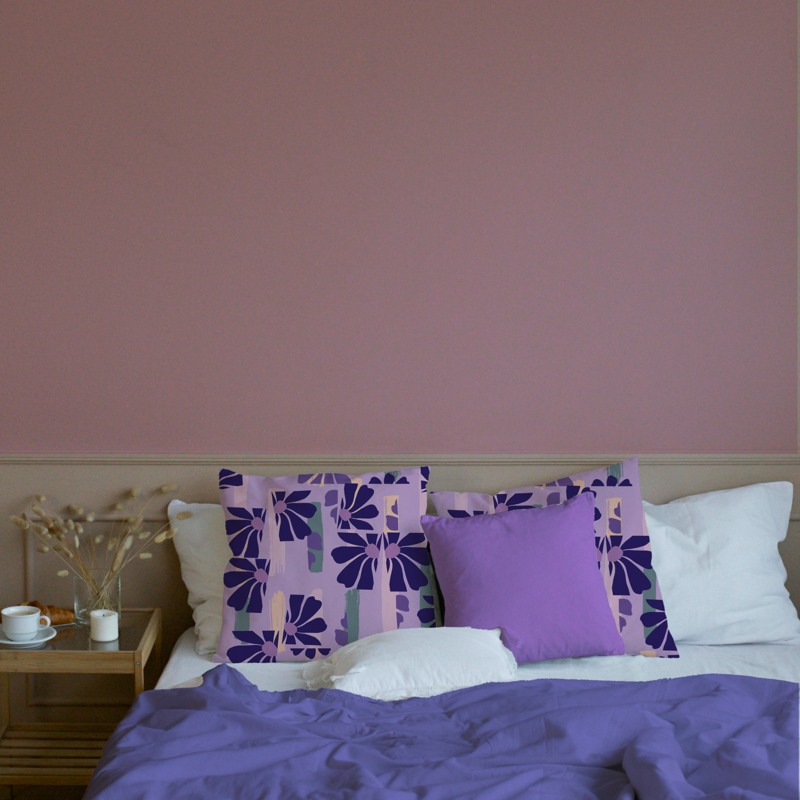 Lilac floral abstract cushion covers styled on a modern bed with purple bedding in a pastel-themed bedroom