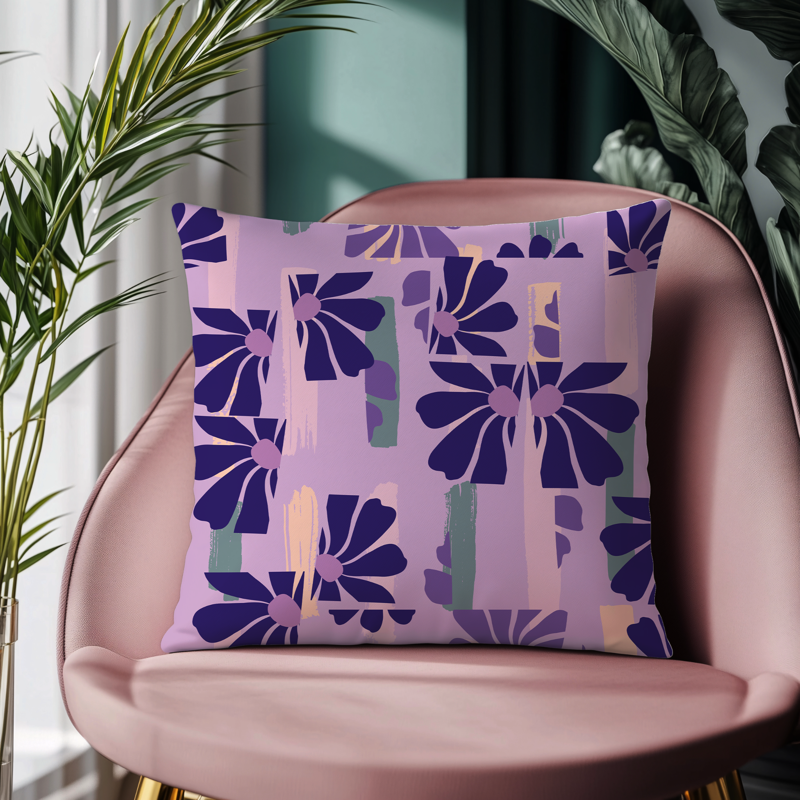 Purple floral abstract cushion cover on a blush pink chair in modern home décor setting
