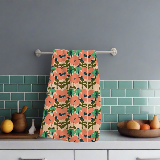 a peach coloured floral designed kitchen tea towel 